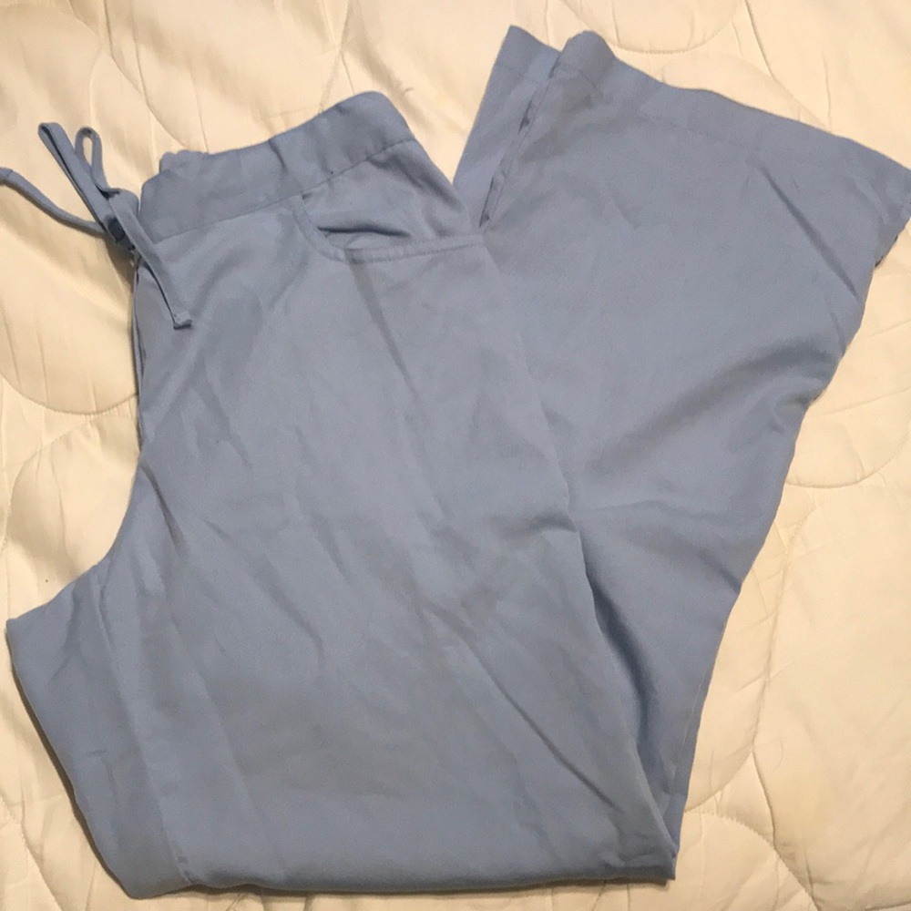 Blue scrub bottoms.